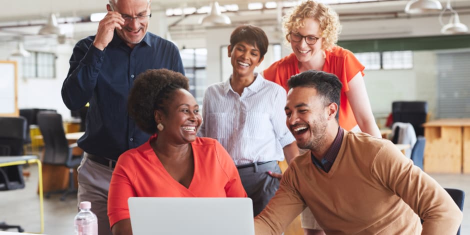 People in the office looking at Awin's top 10 affiliate marketers for 2024